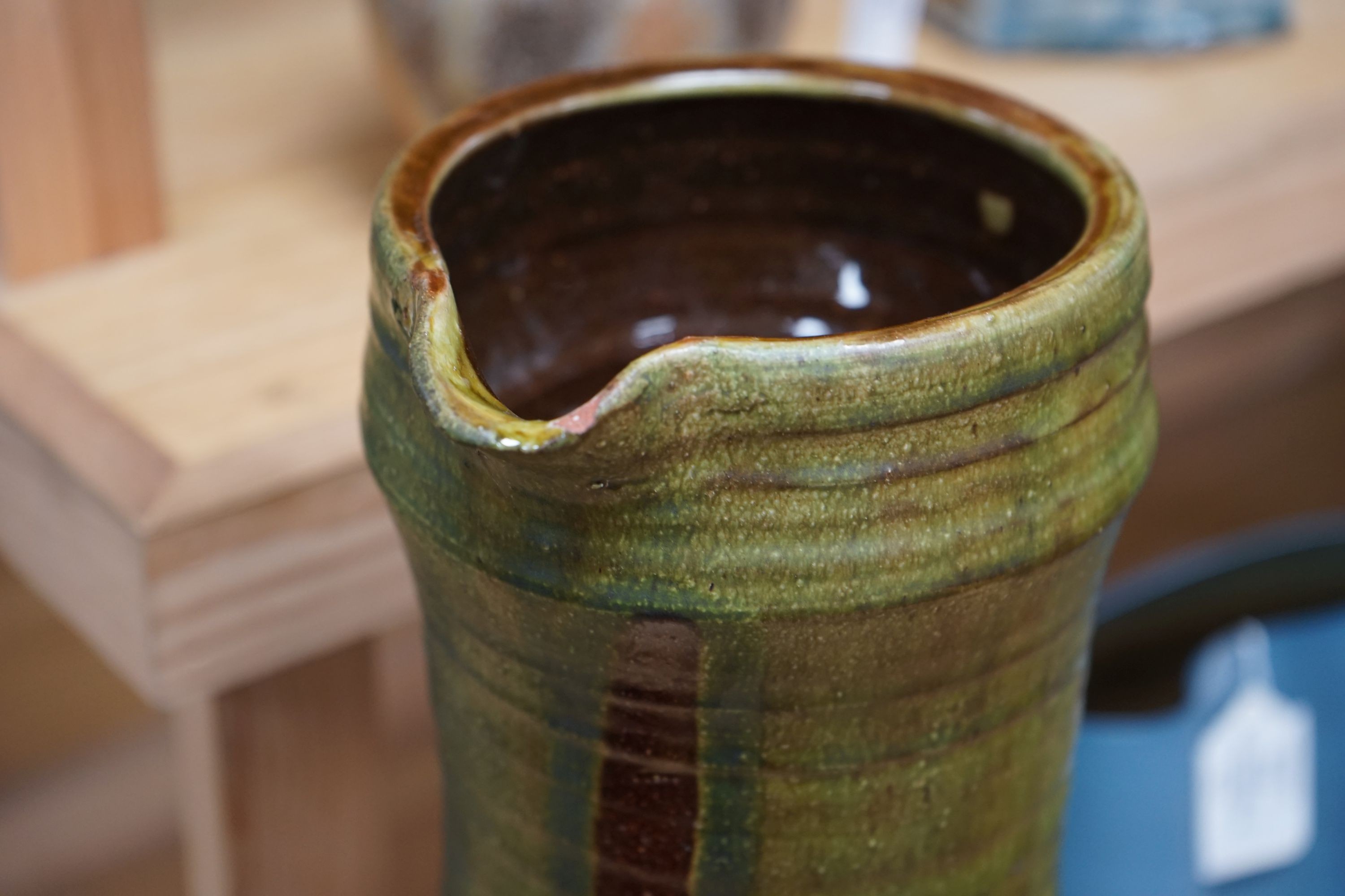 Clive Bowen (b.1943), a tall green glazed and brown slip decorated ewer, 59cm